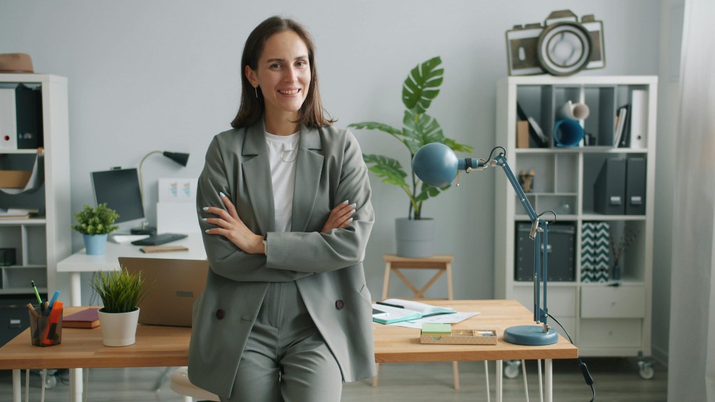 Confident professional in a bright modern workspace with laptop and planner